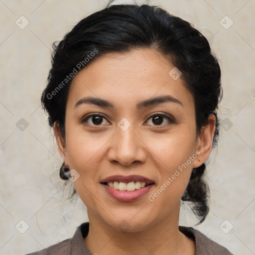 Joyful latino young-adult female with medium  brown hair and brown eyes