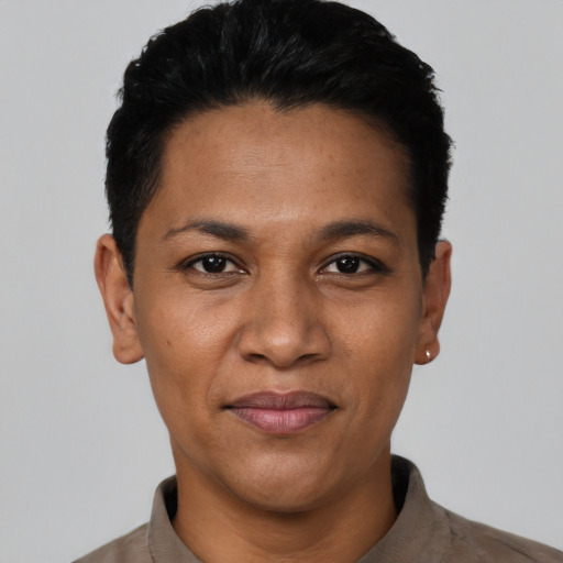 Joyful latino young-adult female with short  black hair and brown eyes