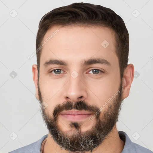 Neutral white young-adult male with short  brown hair and brown eyes