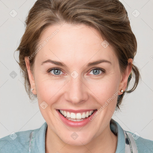 Joyful white young-adult female with medium  brown hair and blue eyes