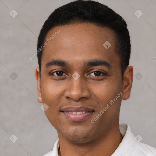 Joyful latino young-adult male with short  black hair and brown eyes