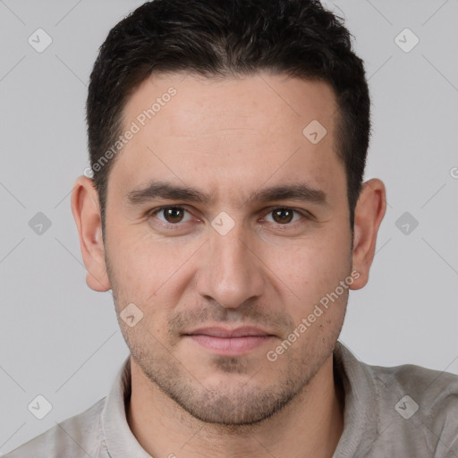 Joyful white young-adult male with short  brown hair and brown eyes