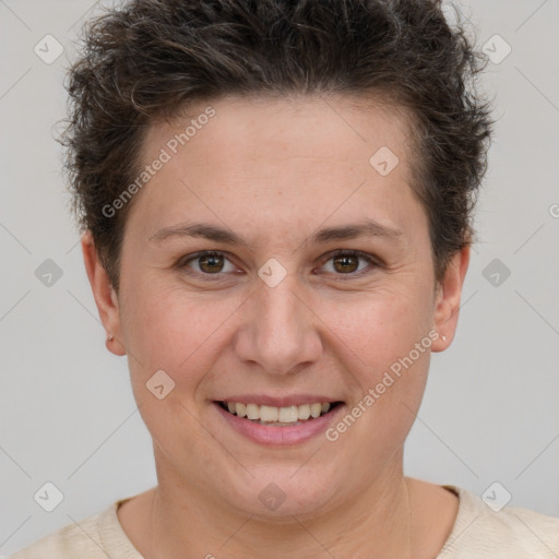 Joyful white adult female with short  brown hair and brown eyes