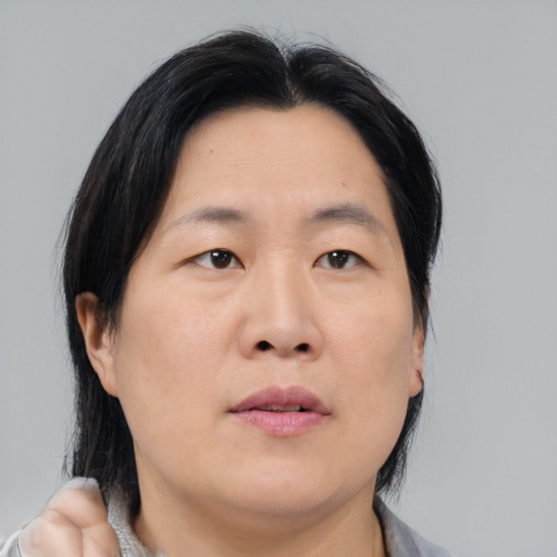 Neutral asian young-adult female with medium  black hair and brown eyes