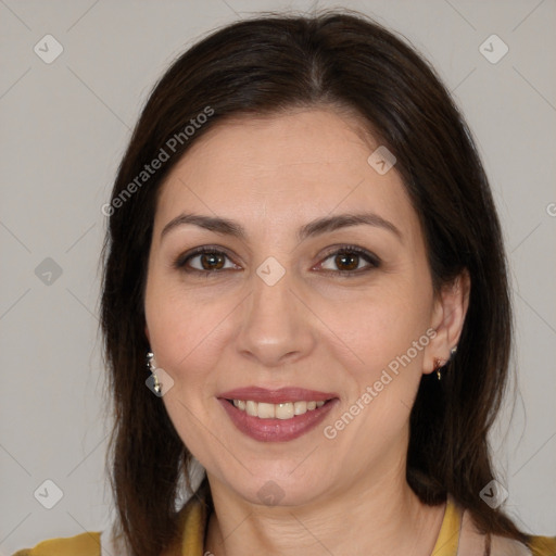 Joyful white adult female with medium  brown hair and brown eyes