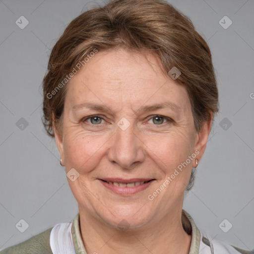 Joyful white adult female with medium  brown hair and grey eyes