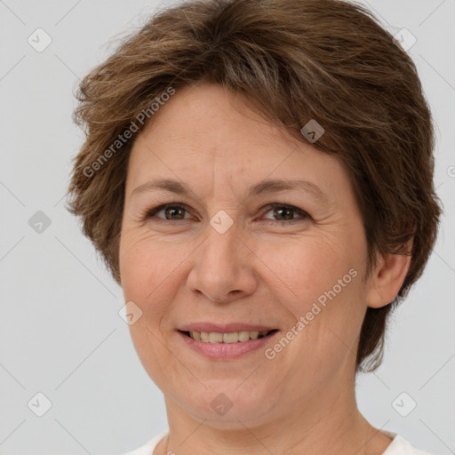 Joyful white adult female with short  brown hair and brown eyes