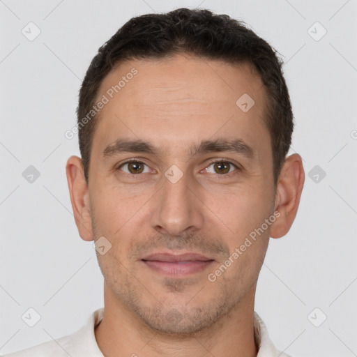 Joyful white adult male with short  brown hair and brown eyes