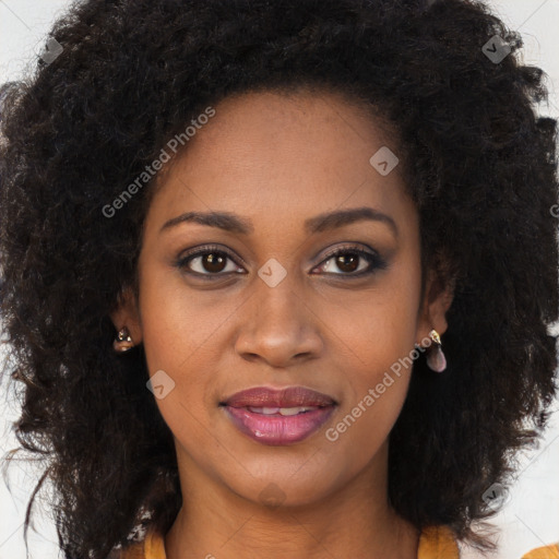 Joyful black young-adult female with long  brown hair and brown eyes