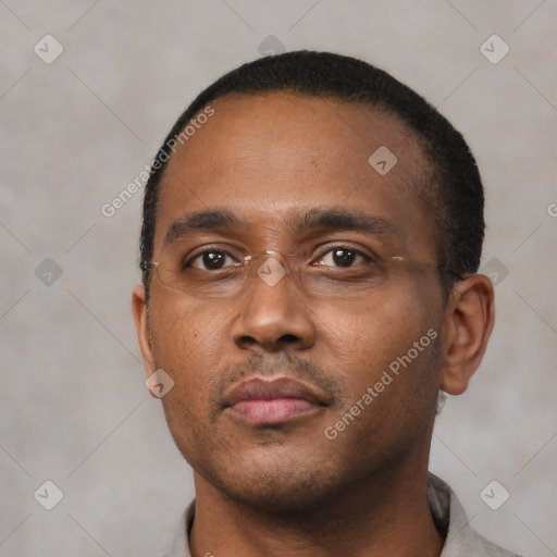 Neutral black young-adult male with short  black hair and brown eyes