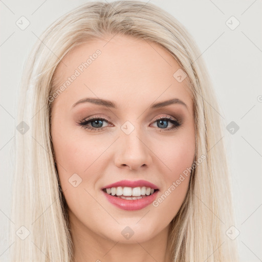 Joyful white young-adult female with long  brown hair and blue eyes