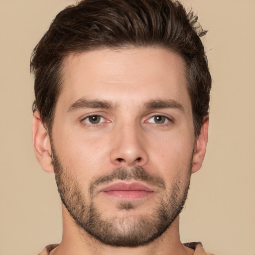 Joyful white young-adult male with short  brown hair and brown eyes