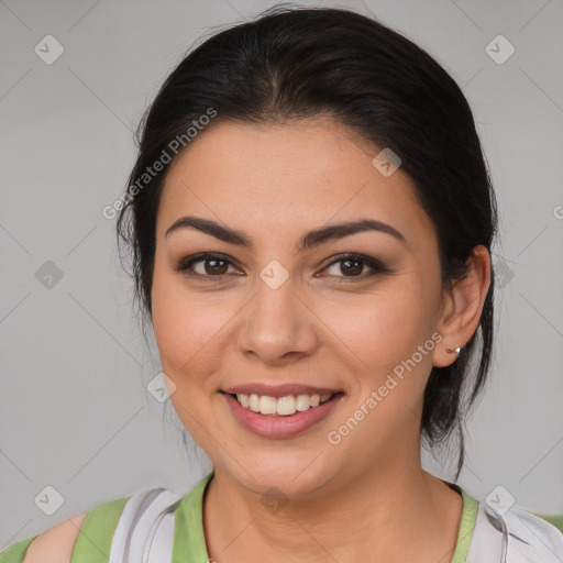 Joyful latino young-adult female with medium  brown hair and brown eyes