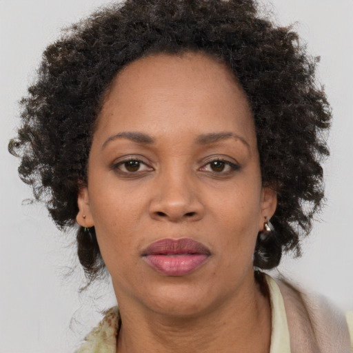 Neutral black adult female with long  brown hair and brown eyes