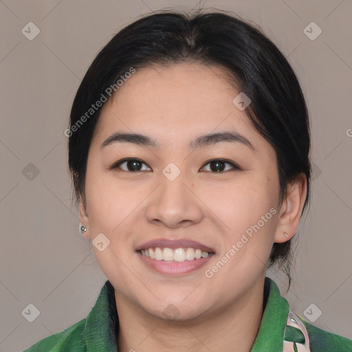 Joyful asian young-adult female with medium  brown hair and brown eyes