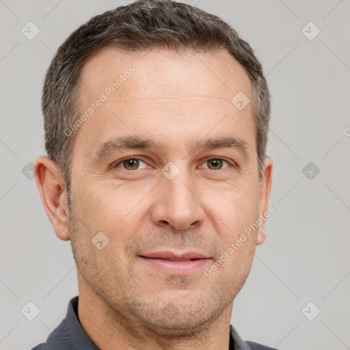 Joyful white adult male with short  brown hair and brown eyes