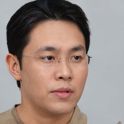 Neutral asian young-adult male with short  brown hair and brown eyes