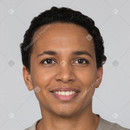 Joyful black young-adult male with short  black hair and brown eyes