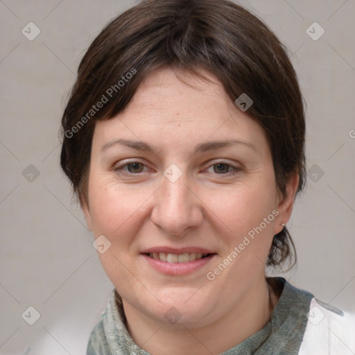 Joyful white adult female with medium  brown hair and grey eyes