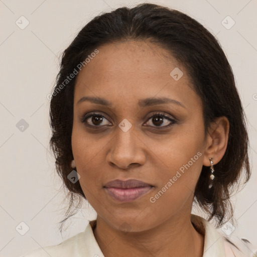 Joyful black young-adult female with medium  brown hair and brown eyes