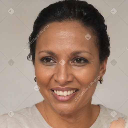 Joyful black adult female with short  brown hair and brown eyes