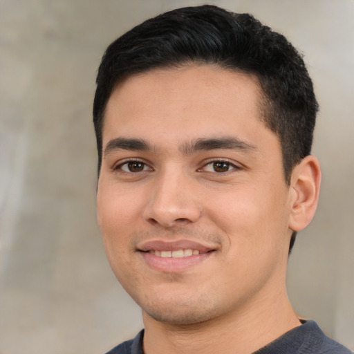 Joyful asian young-adult male with short  black hair and brown eyes