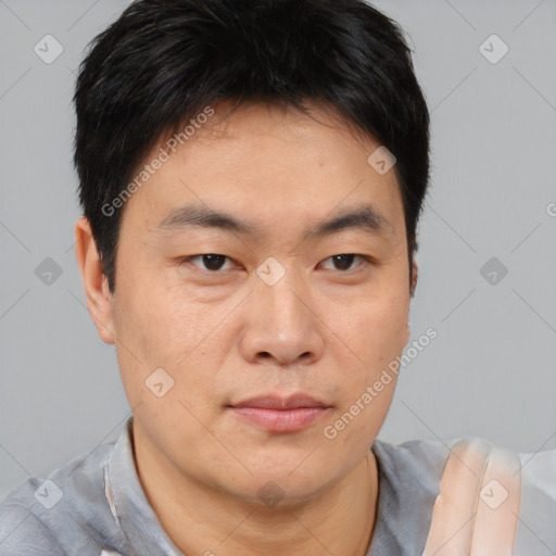Neutral asian young-adult male with short  brown hair and brown eyes