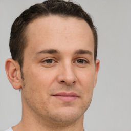 Neutral white young-adult male with short  brown hair and brown eyes