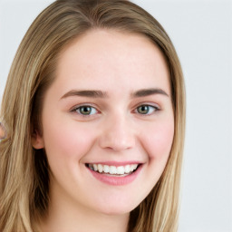 Joyful white young-adult female with long  brown hair and blue eyes