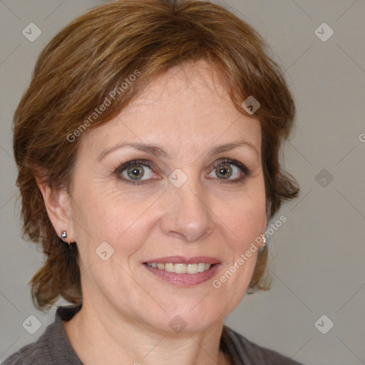 Joyful white adult female with medium  brown hair and grey eyes