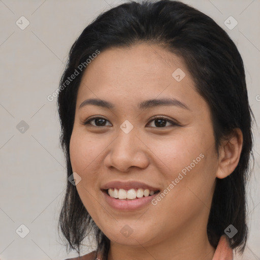 Joyful asian young-adult female with medium  brown hair and brown eyes