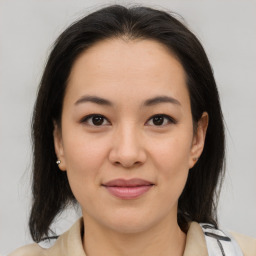 Joyful asian young-adult female with medium  brown hair and brown eyes