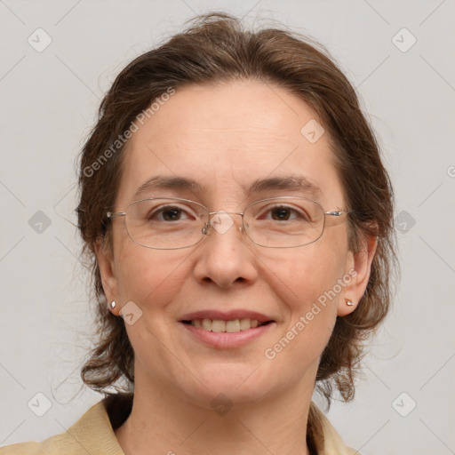 Joyful white adult female with medium  brown hair and grey eyes