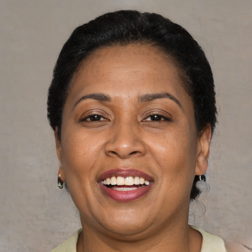 Joyful asian adult female with short  brown hair and brown eyes