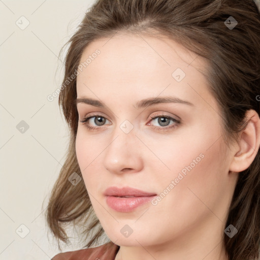 Neutral white young-adult female with medium  brown hair and green eyes