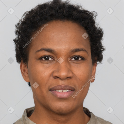 Joyful black adult female with short  brown hair and brown eyes