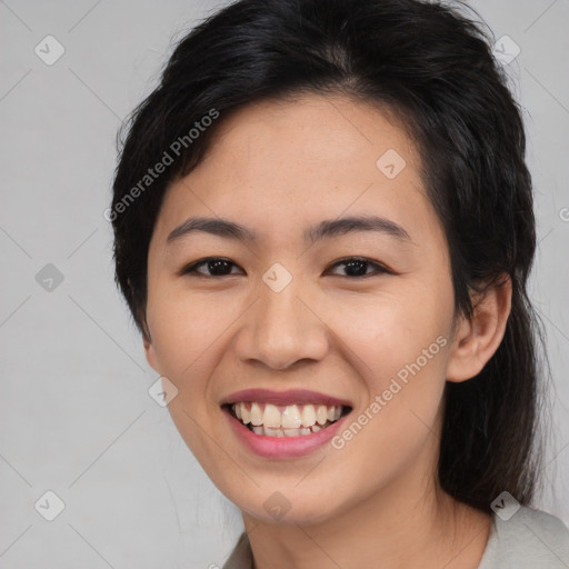 Joyful asian young-adult female with medium  black hair and brown eyes