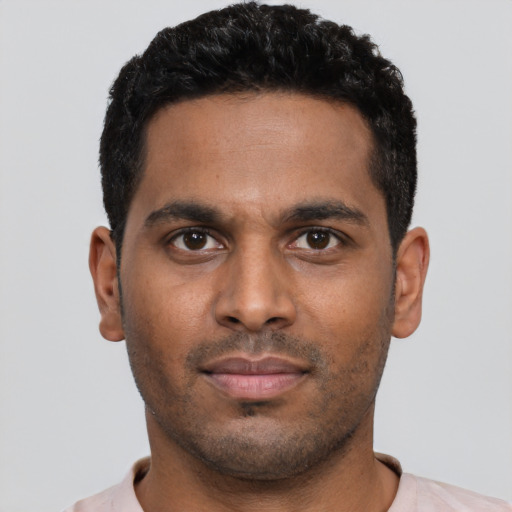 Neutral black young-adult male with short  black hair and brown eyes