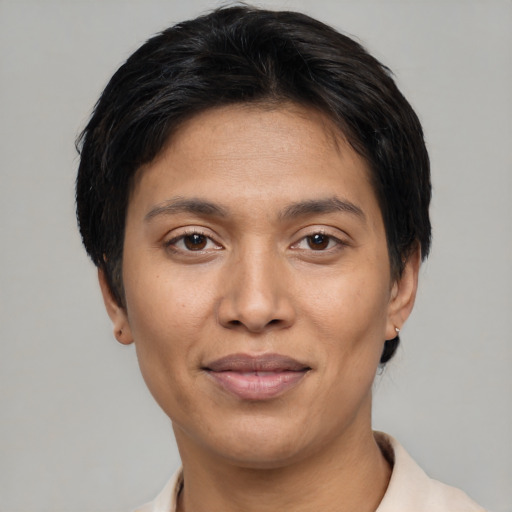 Joyful asian young-adult female with short  brown hair and brown eyes