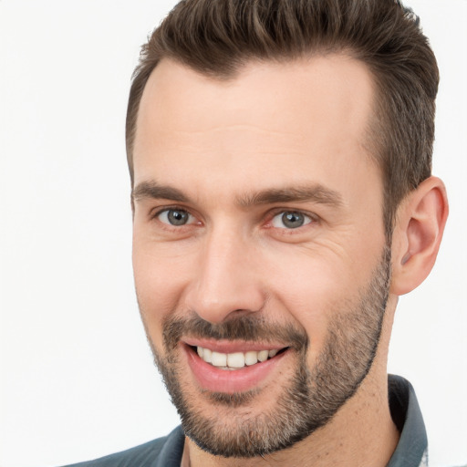 Joyful white young-adult male with short  brown hair and brown eyes