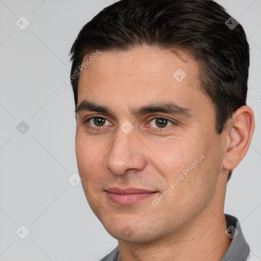 Joyful white adult male with short  brown hair and brown eyes