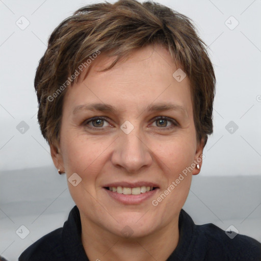 Joyful white adult female with short  brown hair and grey eyes