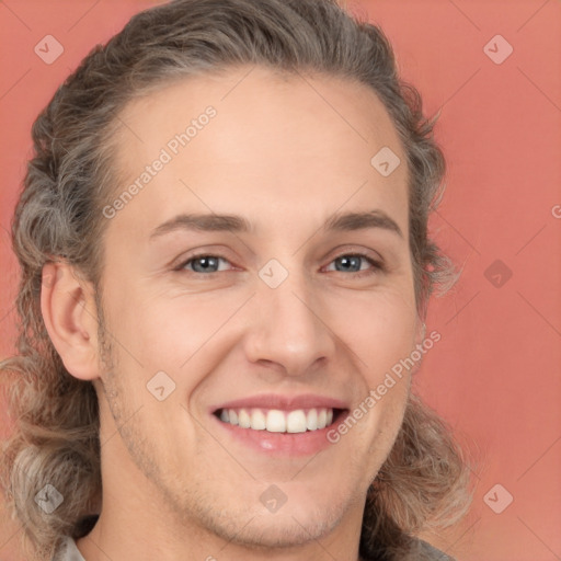 Joyful white young-adult male with medium  brown hair and brown eyes