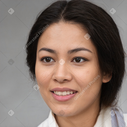 Joyful latino young-adult female with medium  brown hair and brown eyes