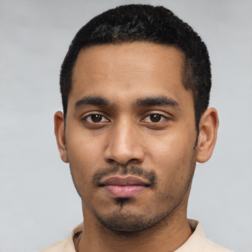 Neutral latino young-adult male with short  black hair and brown eyes