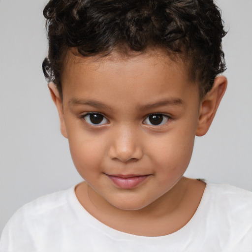 Joyful white child male with short  brown hair and brown eyes