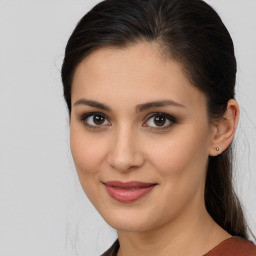 Joyful white young-adult female with medium  brown hair and brown eyes