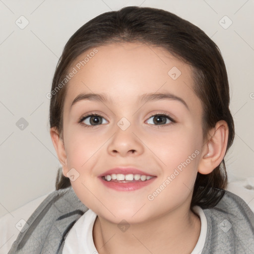 Joyful white child female with medium  brown hair and brown eyes