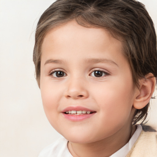 Joyful white child female with short  brown hair and brown eyes