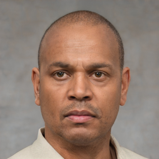 Neutral latino adult male with short  brown hair and brown eyes